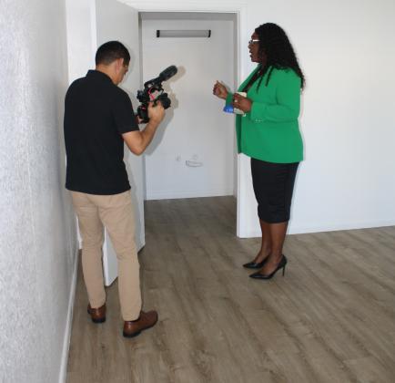 Kissimmee Deputy City Manager Desiree Matthews, who oversees affordable housing efforts, talks with a reporter about the changes that will be made to old hotel rooms at Haven on Vine.  (Photo/Christine Pike)
