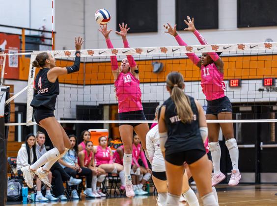 Osceola's Sophie Spivey (10) and Mikayla Matthews (11) try to stop Winter Park's Sophia Stallworth from scoring a point Tuesday. (Photo/Taylor McFee)