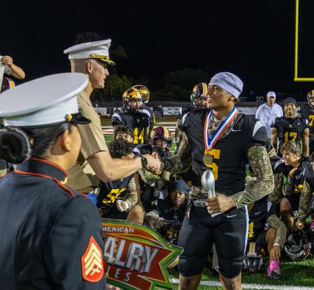Bryce Williams receives his Soldier City Classic MVP award from, appropriately, a member of the Armed Forces. (Photo/Taylor McFee)