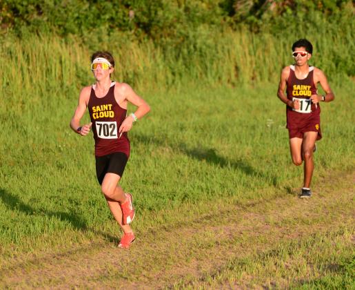 St. Cloud junior Brody Ansbaugh (left) stayed just ahead of teammate Luis Rivera to claim the boys individual title in 17:06.45. (Photo/Donald Lamb)