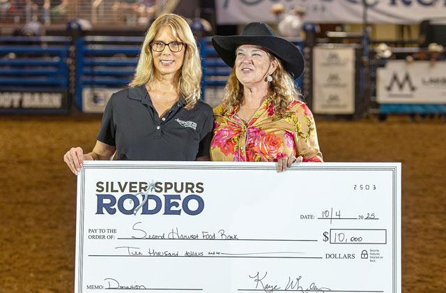 Silver Spurs 2025-26 Big Boss Kaye Whaley presents a check to the Second Harvest Food Bank at Boots, Bulls and Barrels Saturday. (Photo/Taylor McFee)