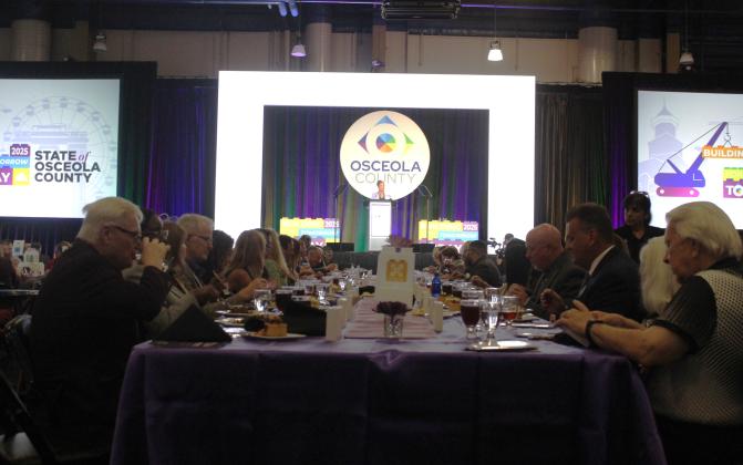 Osceola County Chairwoman Viviana Janer addresses hundreds of attendees of the State of the County luncheon at Osceola Heritage Park Wednesday. (Photo/Ken Jackson)