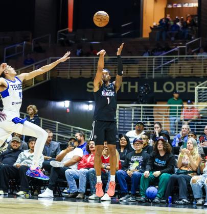 Javonte Smart rises and fires one of the five fourth-quarter three-pointers he sank in Saturday's G League victory. (Photo/Taylor McFee)