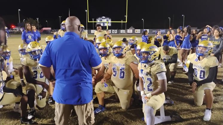 Osceola Coach Eric "EP" Pinellas talks to his team following the playoff game, a 19-13 loss to South Lake. (Photo/J. Daniel Pearson)