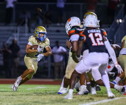 Osceola running back Jaxon Hardnett, shown in the Jones game, scored on an 11-yard run in his final high school game. (Photo/Taylor McFee)