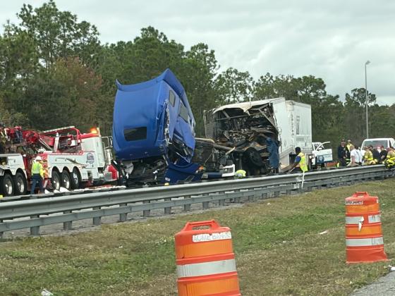 Northbound Turnpike lanes moved at a crawl Wednesday morning as crews worked to clean up an early-morning tractor trailer crash that saw one truck partially engulf in flames. (Photo/Josh Meyers)