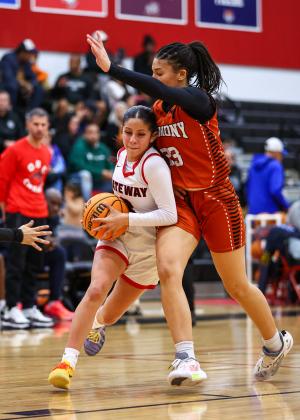 Gateway point guard Alyssa Marino drives on Harmony forward Ella Husbands in Friday's title game. (Photo/Taylor McFee)