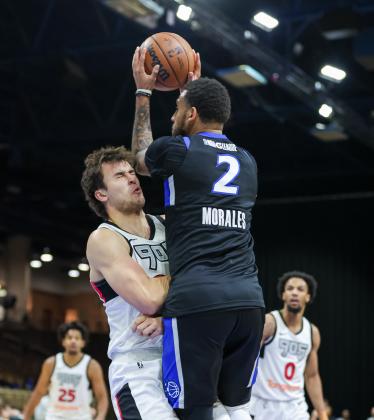 Git' some of this: Alex Morales puts up a shot over Raptors 905's Tyson Degenhart on his way to a double-double in Wednesday's 118-109 wire-to-wire victory. (Photo/Taylor McFee) 