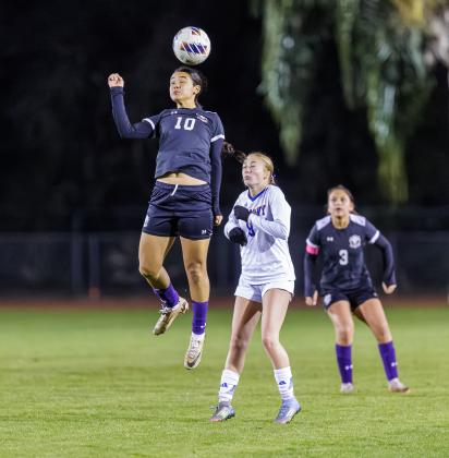 Celebration midfielder Oriana Moreno plays this ball in the air in Tuesday's district championship game against Harmony. (Photo/Taylor McFee)