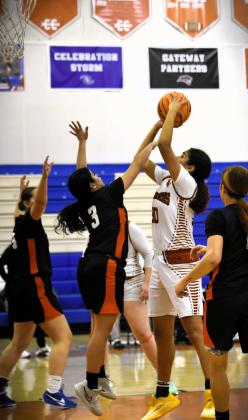 Harmony (in white) defeated Tohopekaliga, 48-25, Wednesday to advance to Friday's OBC girls championship game against host Gateway at 5 p.m. (Photo/Katie Williams)