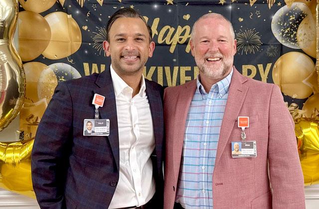 Orlando Health St. Cloud Hospital President Brian Wetzel (right) celebrated 30 years with the Orlando Health network last week with Philip Koovakada, senior vice president of Orlando Health’s South Florida Region. (Photo/Orlando Health)