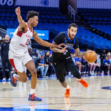 Alex Morales, added to the Orlando Magic roster as a two-way player last week, drives to the basket Friday in Osceola's 128-111 win over the Cleveland Charge at the Kia Center in Orlando. (Photo/Taylor McFee)