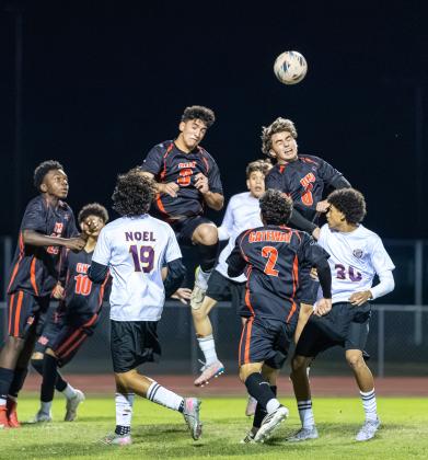 Winning the ball in the air, like this play in December's Orange Belt Conference tournament, has been key for defenders and midfielders like David Sabogal (2), Jesus Linares (3),  Augusto Bustamonte (6), Luisangel Moreno (10) and Keandre Octave (22). (Photo/Taylor McFee)