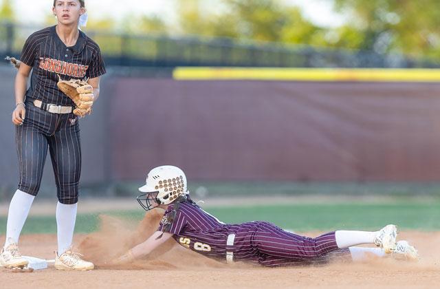 Senior outfielder Grace Comiskey (sliding into third in last year’s district championship game) is one of the returning cogs in the St. Cloud Bulldogs lineup as they try to defend Orange Belt Conference and District 7A-6 titles. (Photo/Taylor McFee)