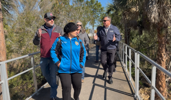 ommissioner Viviana Janer explores the new walking trail at 65th Infantry Veterans Park in Buenaventura Lakes Tuesday morning. (Photo/Osceola County)