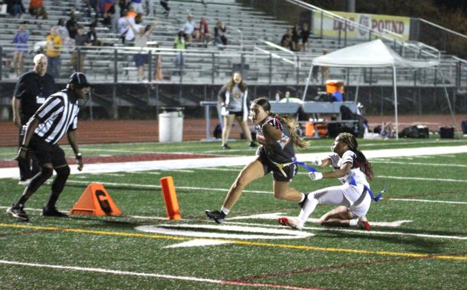 Khloe Cook-Osani scores the winning touchdown in overtime Thursday to give the Harmony Longhorns another OBC flag football championship, 26-20 in overtime over Celebration. (Photo/Michelle Kostuch)