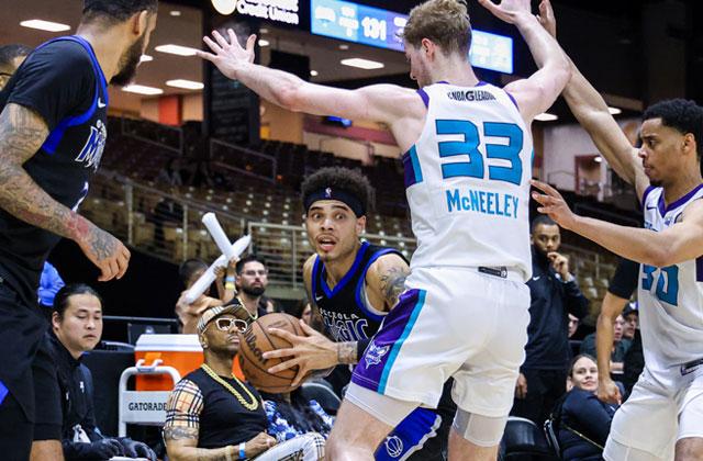 Swarmed under — The Osceola Magic had to find a way out of the shadow of the Greensboro Swarm's Liam McNeely often in the Magic's 134-121 NBA G League Eastern Conference final Sunday at the Silver Spurs Arena. (Photo/Taylor McFee)