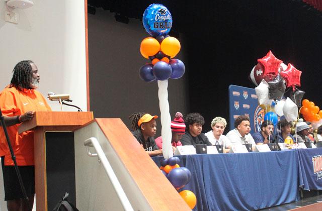 A record 23 Tohopekaliga High student athletes signed college scholarships on a “sweet day” last week in the school’s auditorium — only because the gym couldn’t hold the crowd. (Photo/Ken Jackson)