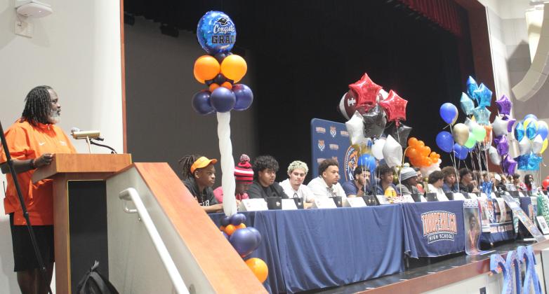A record 23 Tohopekaliga High student athletes signed college scholarships on a “sweet day” last week in the school’s auditorium — only because the gym couldn’t hold the crowd. (Photo/Ken Jackson)