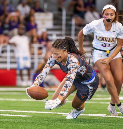 Harmony's Ellah Husbands fights for yardage Friday in the state semifinal flag football game in Tampa. (Photo/Taylor McFee) 