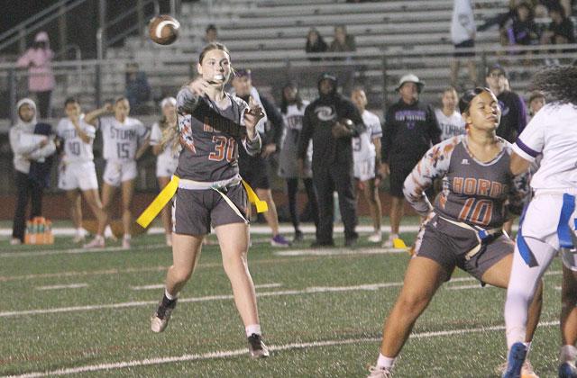 Harmony quarterback Ivy Munns, shown in the OBC title game — another Harmony come-from-behind win — tossed three touchdown passes to help the Longhorns rally to a 26-20 win Monday over Palm Beach Gardens in the 3A regional semifinals. (Photo/Michelle Kostuch)
