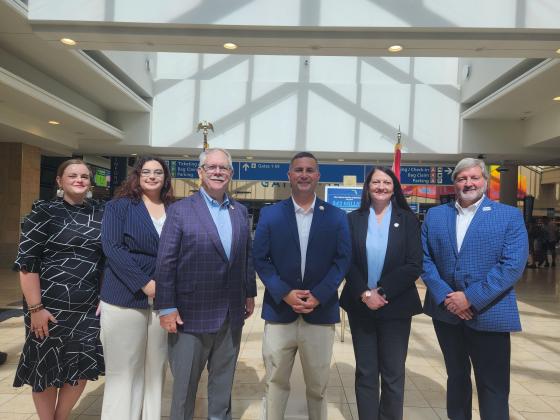 Congressman Darren Soto (center) and Kissimmee Airport Director Shawn Germolus (far right) were at Friday's announcement of a $10 million federal grant awarded to the airport toward building a new traffic control tower. (Photo/Ken Jackson)