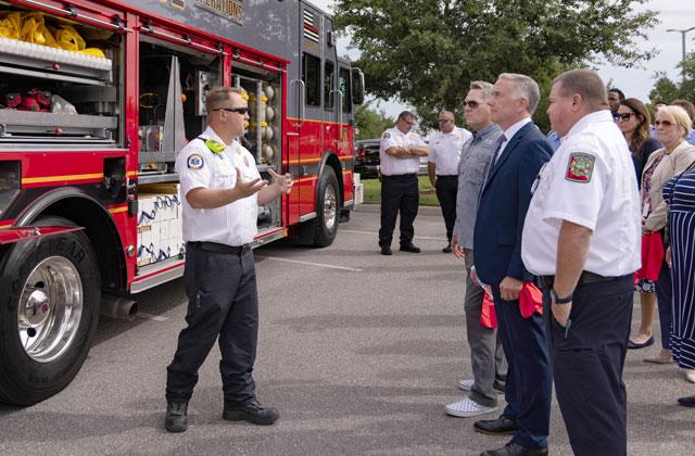 Osceola County Commission Chairman Brandon Arrington and County Manager Don Fisher, with Fire Chief Larry Collier, get an explanation of the capabilities of Osceola County Fire Rescue EMS’ new Heavy Rescue 1 Thursday. (Photo/Osceola County)