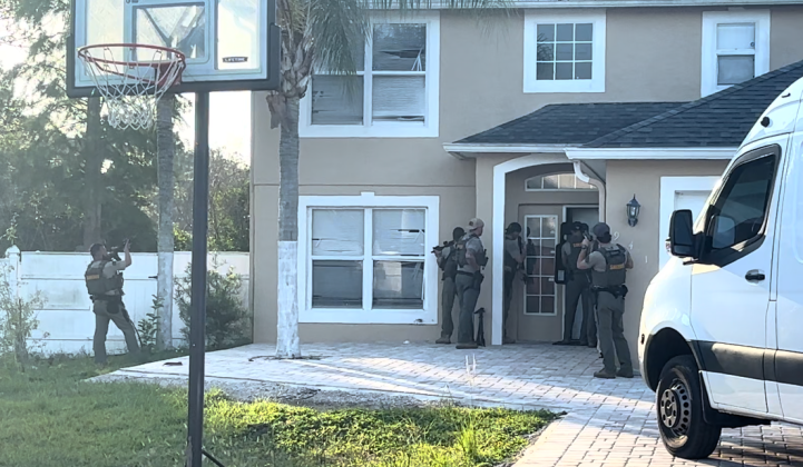 Osceola County SWAT members execute a search warrant at a home on Gillingham Court in Kissimmee June 17 as part of an investigation into a string of unlicensed, understaffed assistance living facilities in Osceola and Polk counties. (Photo/Osceola County Sheriff’s Office)