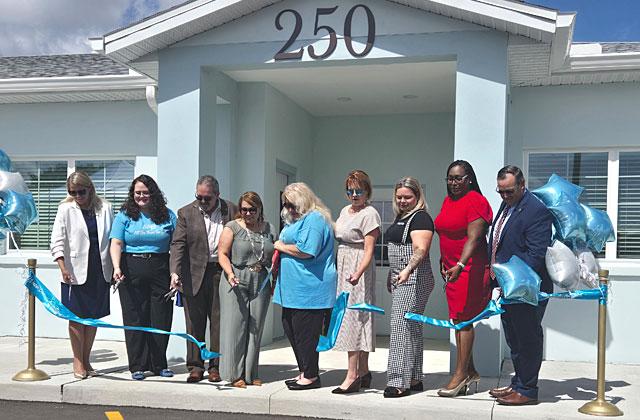 City, County, State and Osceola Council on Aging officials cut the ribbon Friday at the Buen Vecino senior affordable living community in Buenaventura Lakes. (Photo/Ken Jackson)
