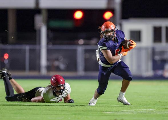 Tohopekaliga running back Hector Saenz leaves an Innovation defender in his wake in the Tigers' 21-14 Kickoff Classic victory Friday. (Photo/Taylor McFee)