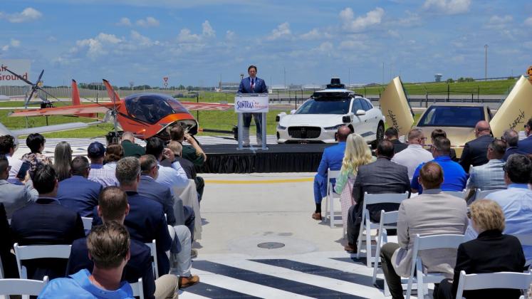 Gov. Ron DeSantis and Transportation Secretary Jared Perdue repeatedly referenced “the Jetsons” to highlight that testing on electric vertical takeoff and landing aircraft will be underway by the end of the year at the SunTrax test facility in Polk County. (Photo/Governor's Office Twitter)
