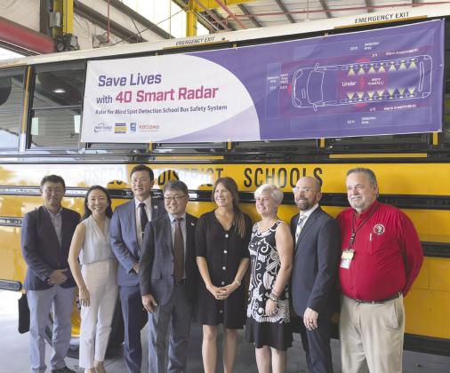 Representatives from Osceola County and Smart Radar System unveil the new bus technology. PHOTO/DEBBIE DANIEL