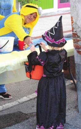 Downtown Kissimmee merchants got in the spirit, giving out candy at Boo! on Broadway