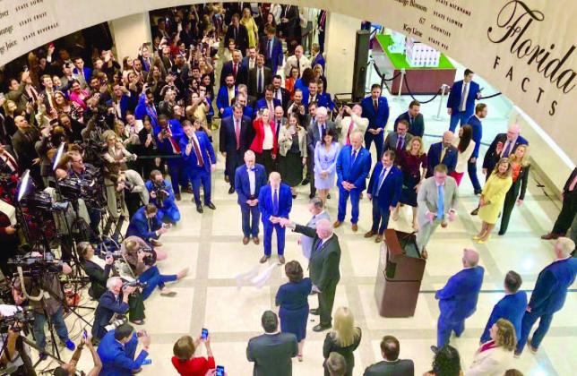 A crowd gathered Friday for a traditional hanky-drop ceremony marking the end of the legislative session. PHOTO/TOM URBAN
