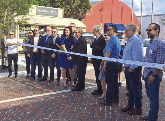 Friday, the St. Cloud Chamber hosted a ribbon cutting ceremony to celebrate the reopening of the Pennsylvania Avenue in downtown St. Cloud after a streetscaping construction project plagued by hurricane delays. PHOTOS BY MING HENRY