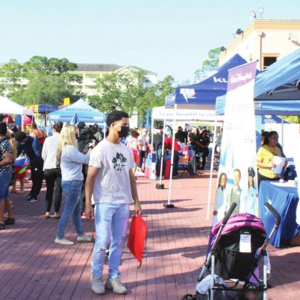Hundreds of children and families gathered Sunday at Old Town to celebrate Three Kings Day, an annual local event sponsored by the Kissimmee/Osceola Chamber of Commerce. PHOTOS/TERRY LLOYD