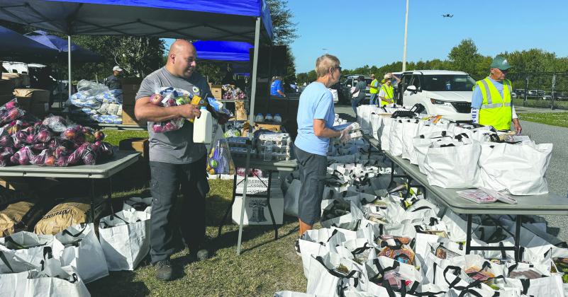 Commissioner Brandon Arrington hosted his second annual Holiday Food Distribution event at St. Rose of Lima Church in Kissimmee Saturday, providing 600 families with the basics of a holiday meal. (Photo/Osceola County)