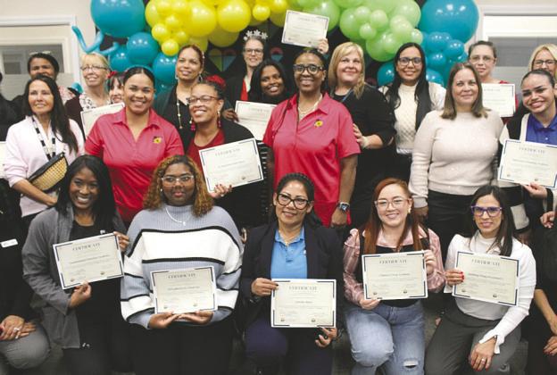 VPK Providers holding up their awards. (Photo/Emely Albelo)