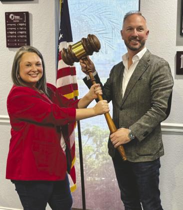 The Osceola Chamber Chairman Tim Weisheyer has ceremoniously passed the gavel to 2026 Chairwoman Rebekah Hurd, who will assume the role officially on Jan. 1. (Photo/The Osceola Chamber)