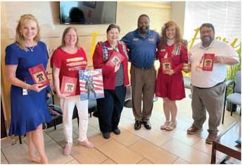The National Society Daughters of the American Revolution local chapters presented booklets to be distributed to all Osceola County fifth graders for Constitution Day the week of Sept. 17. PHOTO/JOSHUA STEVENS DAR