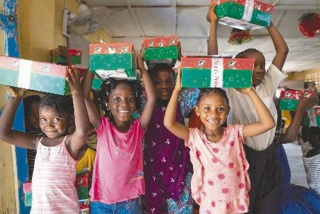 Children receive their shoeboxes from Samaritan’s Purse. (Photo/Samaritan’s Purse)