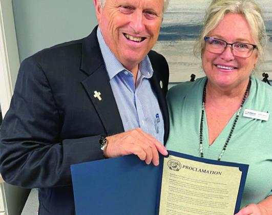 Apopka Mayor Brian Nelson presented Bolander Cohen a proclamation for The Lifeboat Project’s work. PHOTOS/THE LIFEBOAT PROJECT