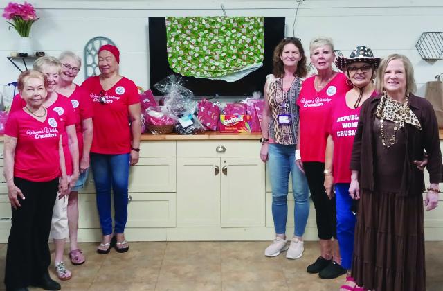 The Republican Women Crusaders offered up “Christmas in July” to families at a local shelter.