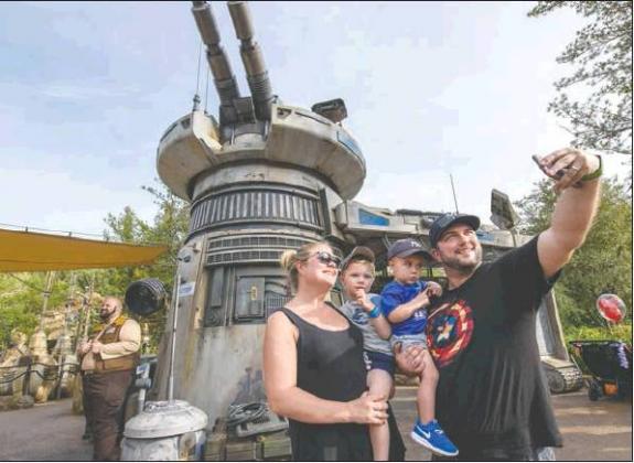 PHOTO/TODD ANDERSON Guests at Disney’s Hollywood Studios stop for a selfie at the entrance to Star Wars: Rise of the Resistance on the attraction’s opening day, Dec. 5, at Walt Disney World Resort in Lake Buena Vista. The groundbreaking new attraction inside Star Wars: Galaxy’s Edge brings guests into a climactic battle between the Resistance and the First Order.