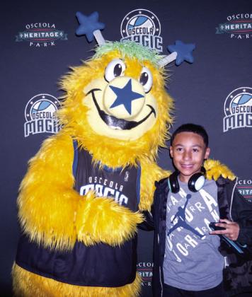 Swish, the Osceola Magic's mascot, makes friends.