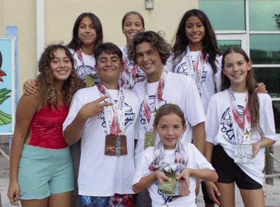 The members of the KSA Tiger Sharks swim team had themselves a summer, earning medals and setting dozens of personal bests at the State Games in Iowa. PHOTO/LINDSEY TELLEZ