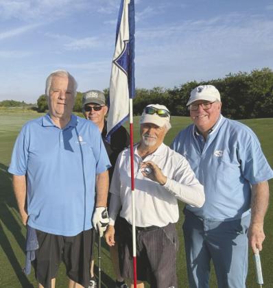 Buck Denzer (center, white shirt) aced the 6th hole on the Royal St. Cloud Golf Links White nine in back-to-back rounds. SUBMITTED PHOTO