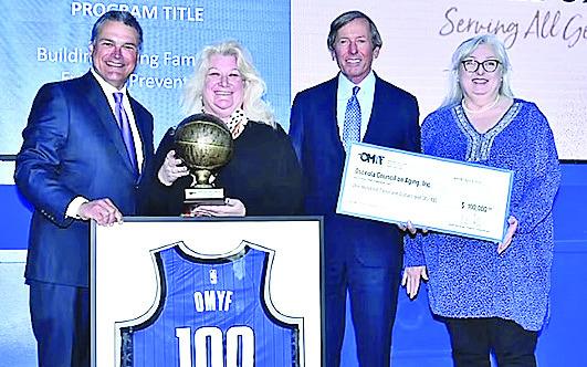 Pictured from left: Orlando Magic CEO, Alex Martins, OCOA President &amp; CEO Wendy Ford, Orlando Magic Chairman, Dan DeVos and OCOA Grants Manager Lisa Wright. PHOTO/OSCEOLA COUNCIL ON AGING