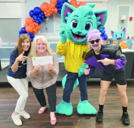 Bingo Blitz presented a $25,000 check to the Osceola Meals on Wheels program at Friday’s event. PHOTO/OSCEOLA COUNCIL ON AGING