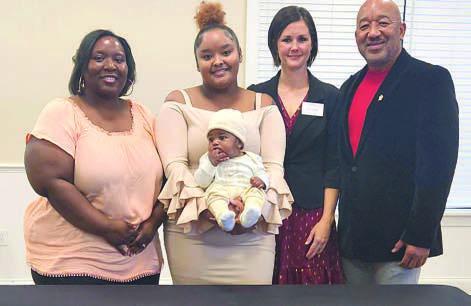 From left, Healthy Start of Osceola County Program Supervisor Terrissa Gandy, Healthy Start client Amorye and her son, Executive Director Kerri Stephen and Board of Directors Chair Dr. Rufus Barfield were part of the organization’s annual meeting Dec. 7. PHOTO/KEN JACKSON